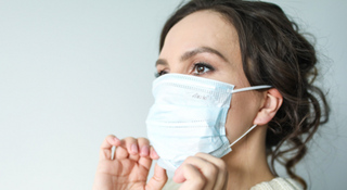 Maskne - Woman wearing mask -  Dermatologist's Choice