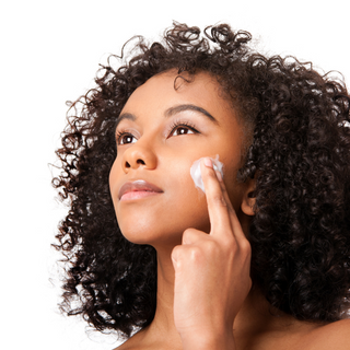 Applying moisturizer on face
