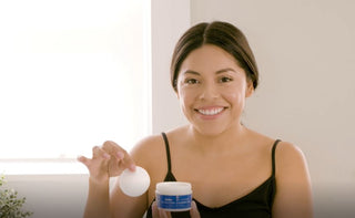 Woman using Glycolic Peel Cleansing Pads